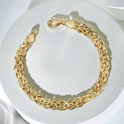 14K Italian-made gold bracelet on table